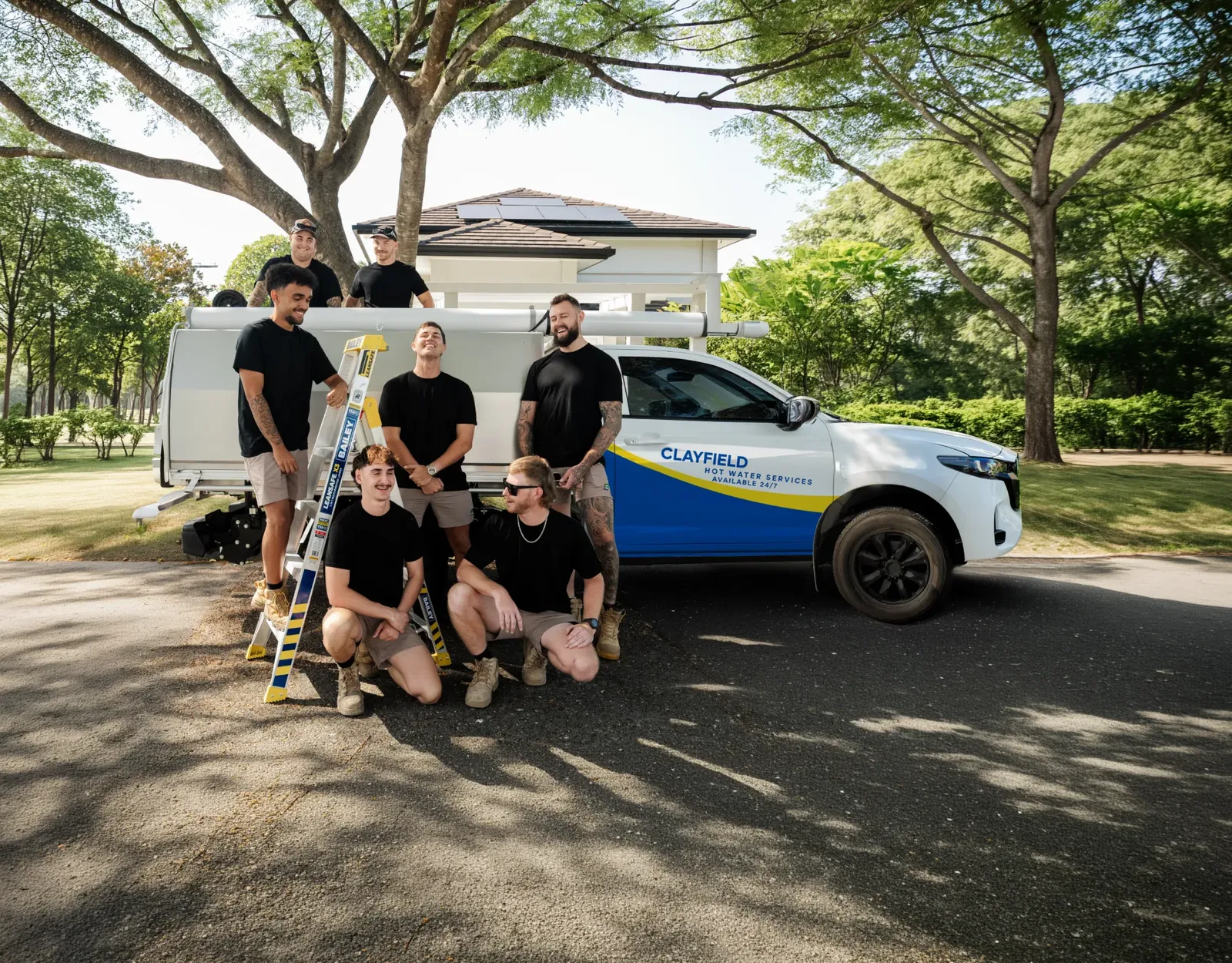 Clayfield Hot Water Services ute and team